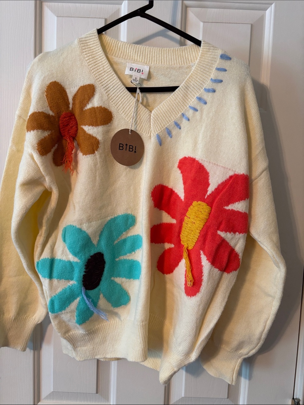 BiBi Cream V-Neck Sweater with Red, Turquoise & Brown Floral Appliqués